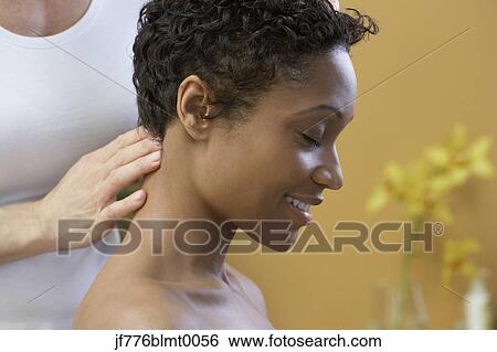 African woman receiving massage View Large Photo Image Stock Photograph - African woman receiving massage. Fotosearch
