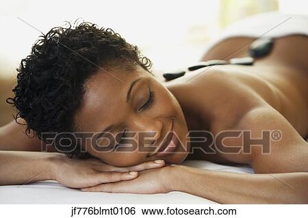 Stock Photograph - African woman receiving spa treatment. Fotosearch