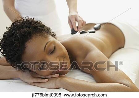 Stock Photography - African woman receiving spa treatment. Fotosearch