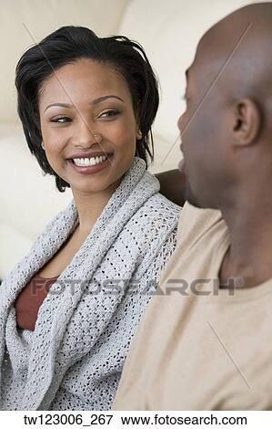 African woman smiling at husband View Large Photo Image Stock Photo - African woman smiling at husband. Fotosearch