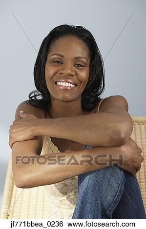 Stock Photograph - African woman with arms crossed. Fotosearch