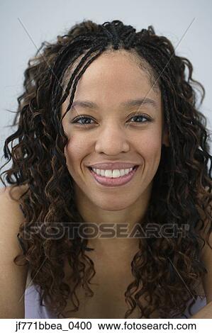 Stock Image - African woman with curly hair. Fotosearch