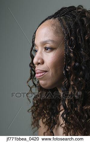 Stock Image - African woman with curly hair. Fotosearch