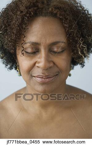 Stock Photography - African woman with eyes closed. Fotosearch