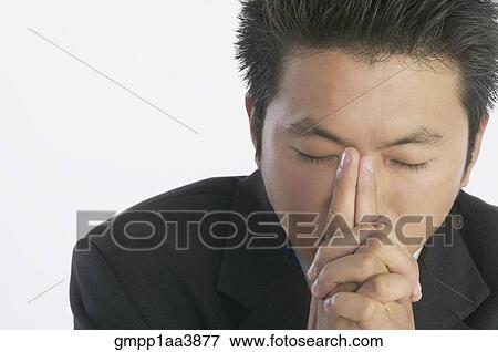 Asian businessman thinking View Large Photo Image Stock Photo - Asian businessman thinking. Fotosearch