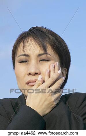 Asian businesswoman with toothache View Large Photo Image Stock Image - Asian businesswoman with toothache. Fotosearch