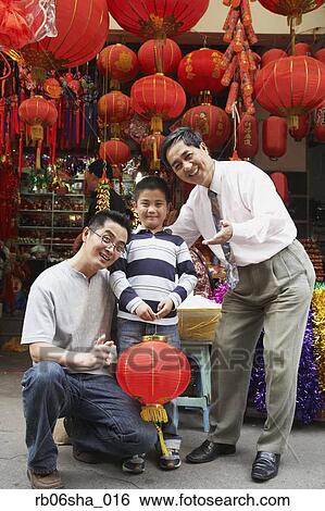Asian grandfather, father and son in front of lantern shop View Large Photo Image Stock Photograph - Asian grandfather, father and son in front of lantern shop. Fotosearch