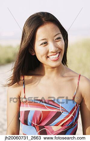 Asian woman at beach View Large Photo Image Stock Image - Asian woman at beach. Fotosearch