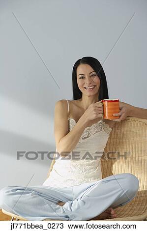 Asian woman holding coffee cup View Large Photo Image Stock Image - Asian woman holding coffee cup. Fotosearch