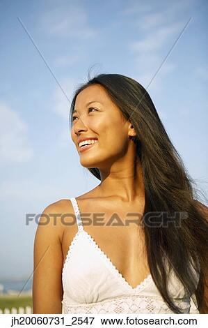 Asian woman looking to side View Large Photo Image Stock Photo - Asian woman looking to side. Fotosearch