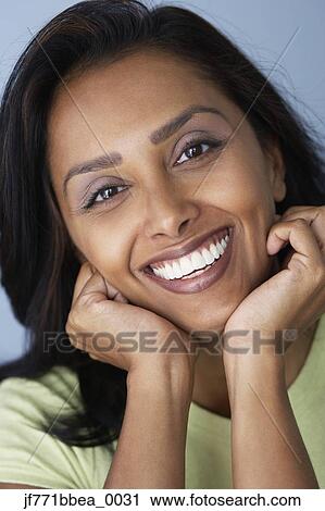 Asian woman resting chin in hands View Large Photo Image Stock Image - Asian woman resting chin in hands. Fotosearch