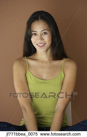 Stock Photography - Asian woman wearing tank top. Fotosearch