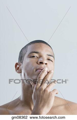 Bare-chested African man thinking View Large Photo Image Stock Image - Bare-chested African man thinking. Fotosearch