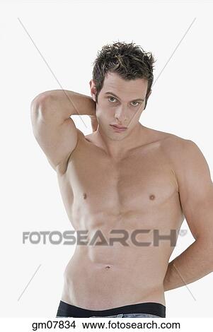 Picture - Bare-chested man with arms behind back. Fotosearch