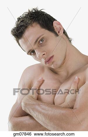 Bare-chested man with arms crossed View Large Photo Image Stock Photograph - Bare-chested man with arms crossed. Fotosearch