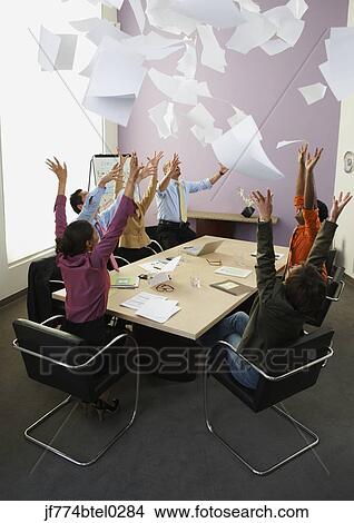 Businesspeople cheering at meeting View Large Photo Image Picture - Businesspeople cheering at meeting. Fotosearch