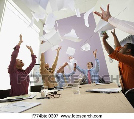 Businesspeople cheering at meeting View Large Photo Image Stock Photo - Businesspeople cheering at meeting. Fotosearch