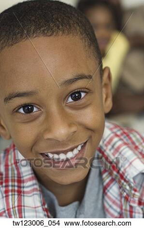 Picture - Close up of African boy smiling. Fotosearch
