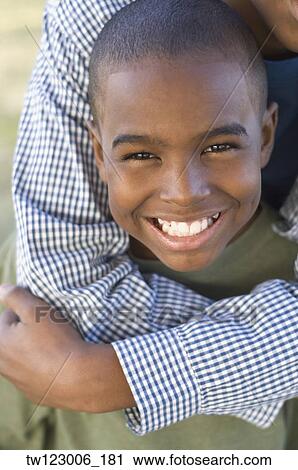 Stock Image - Close up of African boy smiling. Fotosearch
