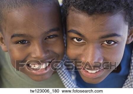Close up of African brothers smiling View Large Photo Image Stock Image - Close up of African brothers smiling. Fotosearch