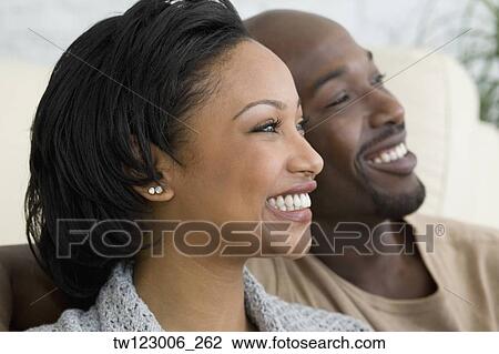 Close up of African couple smiling View Large Photo Image Stock Image - Close up of African couple smiling. Fotosearch