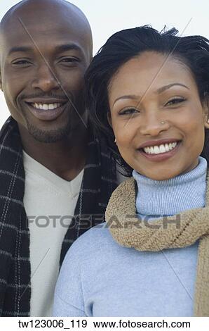 Close up of African couple smiling View Large Photo Image Stock Photo - Close up of African couple smiling. Fotosearch