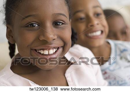 Close up of African girl smiling View Large Photo Image Stock Photo - Close up of African girl smiling. Fotosearch