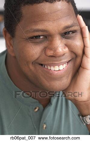 Stock Photo - Close up of African man smiling. Fotosearch