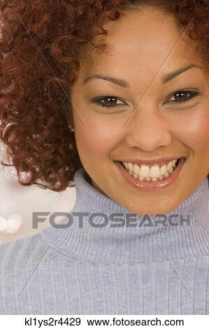 Close up of African woman smiling View Large Photo Image Stock Photo - Close up of African woman smiling. Fotosearch