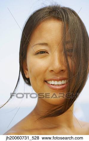 Close up of Asian woman smiling View Large Photo Image Stock Photo - Close up of Asian woman smiling. Fotosearch