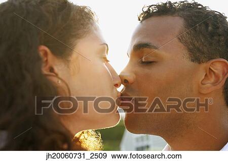 Close up of couple kissing View Large Photo Image Stock Photo - Close up of couple kissing. Fotosearch
