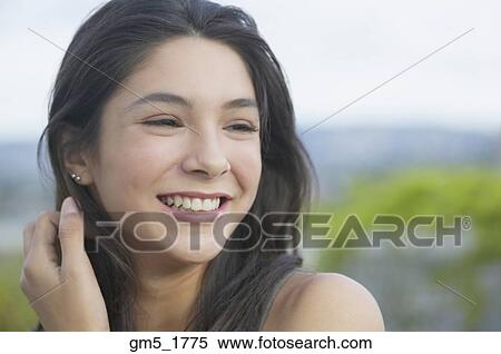 Stock Photography - Close up of Hispanic girl smiling. Fotosearch