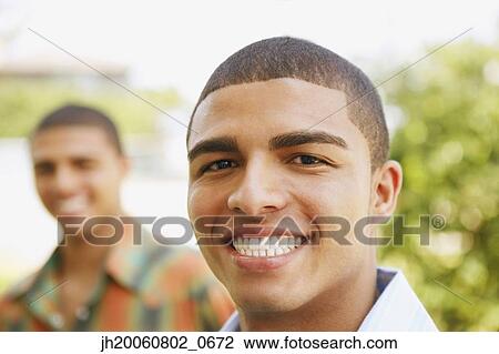 Close up of Hispanic man smiling View Large Photo Image Stock Image - Close up of Hispanic man smiling. Fotosearch