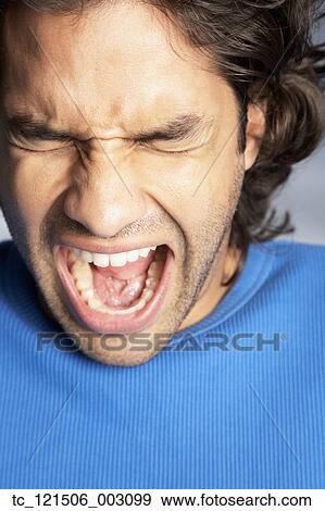 Close up of Hispanic man yelling View Large Photo Image Stock Photo - Close up of Hispanic man yelling. Fotosearch