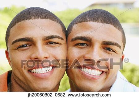 Close up of Hispanic twin brothers smiling View Large Photo Image Stock Image - Close up of Hispanic twin brothers smiling. Fotosearch
