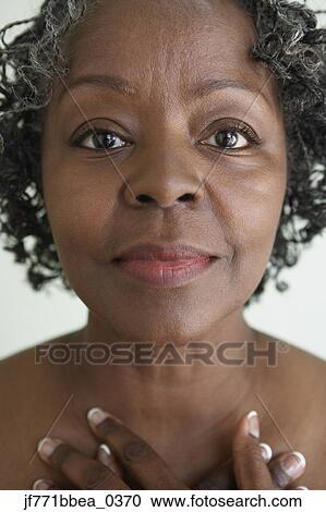 Stock Image - Close up of senior African woman. Fotosearch