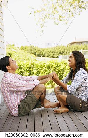 Couple holding hands on deck View Large Photo Image Stock Photograph - Couple holding hands on deck. Fotosearch