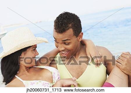 Couple hugging at beach View Large Photo Image Stock Image - Couple hugging at beach. Fotosearch