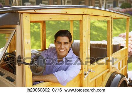 Egyptian man driving old fashioned car View Large Photo Image Stock Photograph - Egyptian man driving old fashioned car. Fotosearch