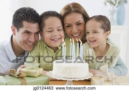 Hispanic boy celebrating birthday with family View Large Photo Image Stock Image - Hispanic boy celebrating birthday with family. Fotosearch