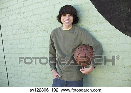 Hispanic boy holding basketball View Large Photo Image Stock Image - Hispanic boy holding basketball. Fotosearch