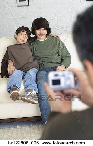Hispanic brothers having photograph taken View Large Photo Image Stock Photograph - Hispanic brothers having photograph taken. Fotosearch