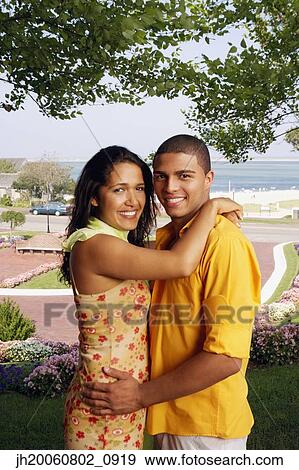 Hispanic couple hugging at beach resort View Large Photo Image Stock Photo - Hispanic couple hugging at beach resort. Fotosearch