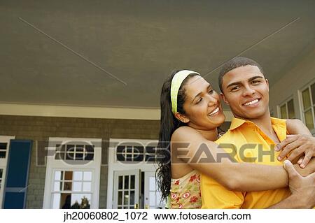 Hispanic couple hugging outdoors View Large Photo Image Stock Image - Hispanic couple hugging outdoors. Fotosearch