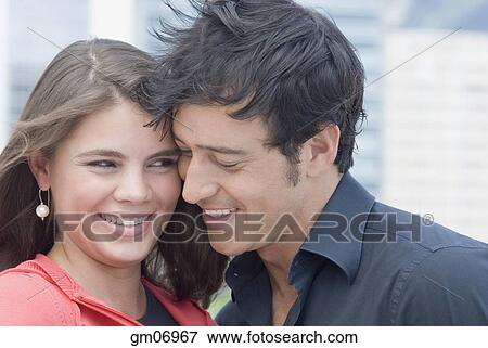 Hispanic couple hugging outdoors View Large Photo Image Stock Photo - Hispanic couple hugging outdoors. Fotosearch
