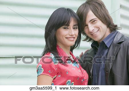 Hispanic couple in front of aluminum siding View Large Photo Image Stock Image - Hispanic couple in front of aluminum siding . Fotosearch