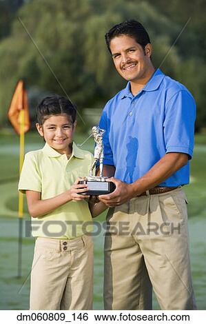 Hispanic father and daughter holding golf trophy View Large Photo Image Stock Photograph - Hispanic father and daughter holding golf trophy. Fotosearch