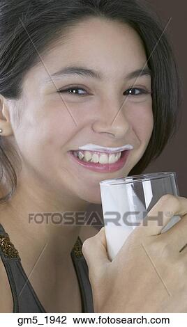 Hispanic girl drinking milk View Large Photo Image Stock Image - Hispanic girl drinking milk. Fotosearch