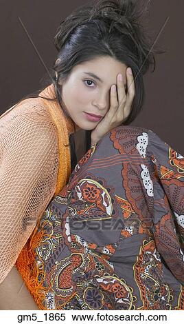 Hispanic girl with hand covering eye View Large Photo Image Stock Photography - Hispanic girl with hand covering eye. Fotosearch