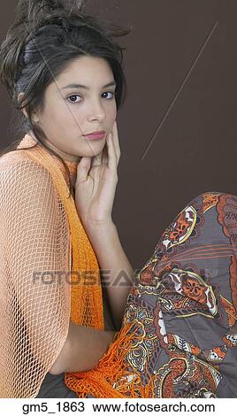 Hispanic girl with hand on face View Large Photo Image Stock Image - Hispanic girl with hand on face. Fotosearch